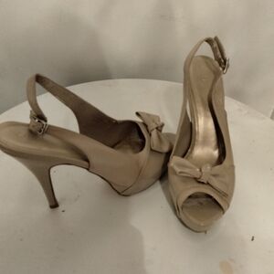 Tan high heel with strap, size 10 medium